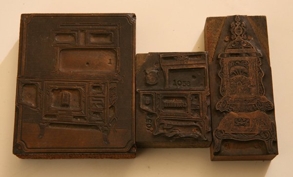 THREE WOOD BURNING STOVE PRINTERS BLOCKS: Including one for “Favorite” Stoves and one for “South Bend Malleable” Stoves, and an unmarked but very ornate parlor stove, circa 1890-1910, 2 x 2.5; 3.25 x 4”; and 1.75 x 4”, all copper