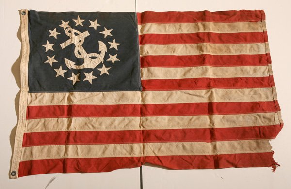 U.S.NAVY FOWLED ANCHOR 13 STAR FLAG: Machine sewn on linen with canvas hoist stamped “Bull Dog Bunting” with two brass grommets, canton with machine sewn 13 stars surrounding a fowled anchor, type commonly used by U.S.N. launches, ci