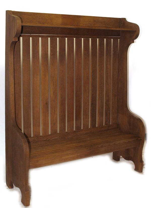 MASSIVE HALL BENCH IN STYLE OF GUSTAV STICKLEY: With slat back and seat with upper shelf and scrolled sides. Refinished. 71" high x 58" wide x 20" deep.