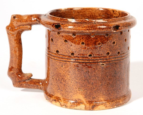 GEORGE OHR POTTERY PUZZLE MUG: From same estate as Lot 131. Unsigned. 3 1/2" high x 5 1/2" wide.
