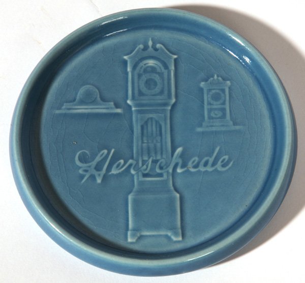 ROOKWOOD POTTERY ADVERTISING HERSCHEDE CLOCKS TRAY: Dated 1943. 6" diameter.