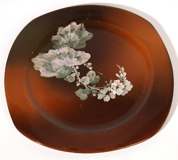 ROOKWOOD POTTERY PLATE BY MATT DALY: Dated 1886, standard glaze with painted flowering cherry branch, impressed “RP” mark without flames over “R” with shape number 817, over “R”, and incised artist initials. 9.5”diameter.