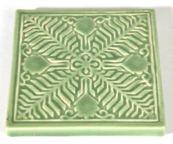ROOKWOOD POTTERY TRIVET: In high gloss green glaze with stylized leaf decoration, dated 1954 and marked “Zonta International Cincinnati June 1954”, 6”square.