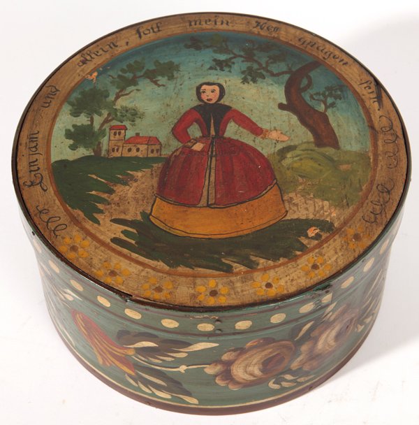 Paint Decorated Pantry Box: Bentwood, circa 1900, with landscape with lady on lid, and inscription in German, sides with floral decoration and interior in red. 9.75” diameter x 5” high, copper tack construction.