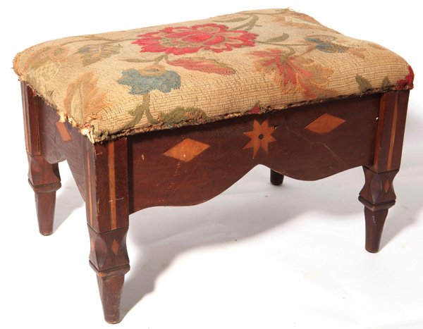 Ohio Folk Art Inlaid Footstool: Circa 1840, in walnut with maple and ebony inlaid stars, diamonds and bars on all four sides and legs. Nice scalloped apron, and blocked legs tapering to turned, with period crewel work upholstered to