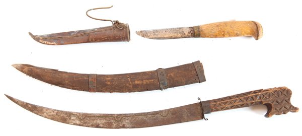 Two Nice Tribal Knives: Including a knife from Lapland with 3.5” single edged blade, signed on right face with 0.3” brass collar and single piece figured birch handle total length 7.75”, in its original tooled leather