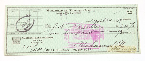 Muhammad Ali Autographed Check: Partially printed check from the “Muhammad Ali Training Camp, Deer Lake, Pa.” for $200 cash dated April 24, 1974 and signed lower right in bold black ink with penned note lower left reading “Cam