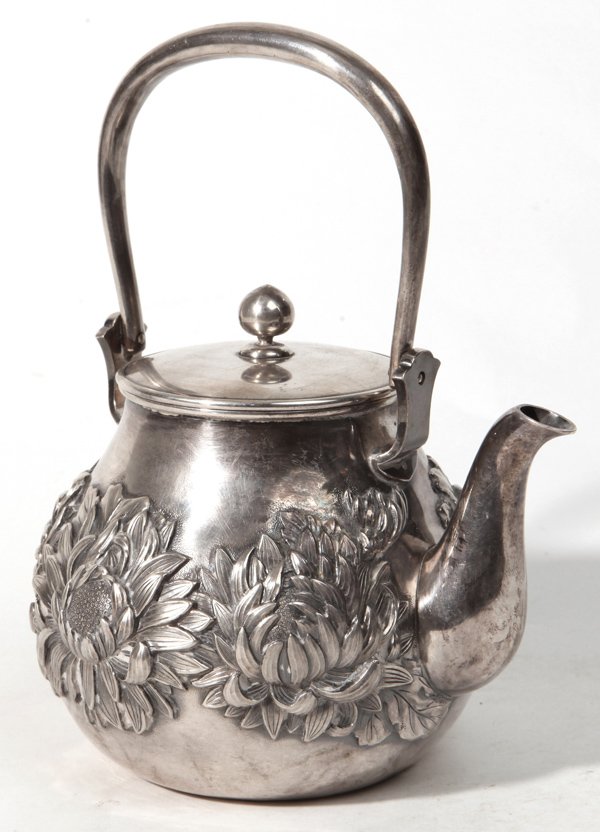 Fine Signed Musashiya Japanese Repousse Silver Teapot: With body nearly covered in very high relief mums, with swing handle and lid with ball finial, signed on base with two blocked Japanese inscriptions - Made by Musashiya. Pure Silver. 4.5" diameter x 5