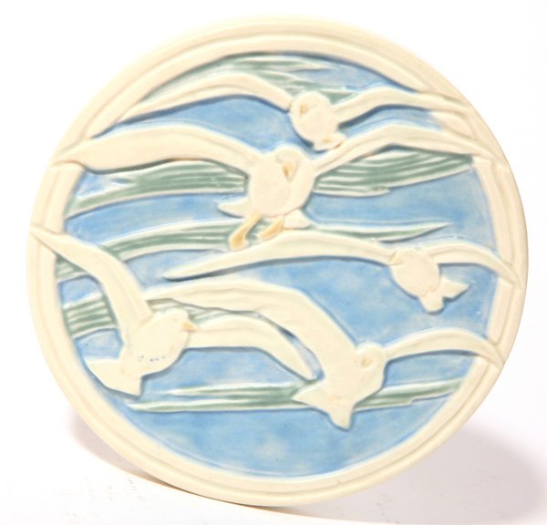Rookwood Pottery Trivet: Rookwood mat glaze 5 3/4" dia. Trivet with carved flying seagulls. Impressed with Rookwood logo, dated, "1943," and numbered, "2351."