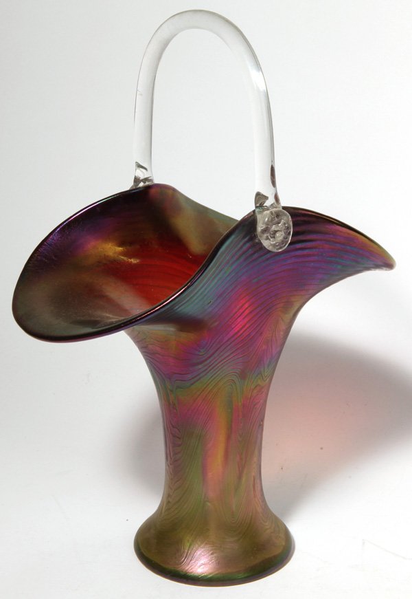 Loetz Iridescent Art Glass Basket: Embossed feather type decoration with a blue, amethyst to green irridescent color. 13 1/2" H x 9 1/2" W.