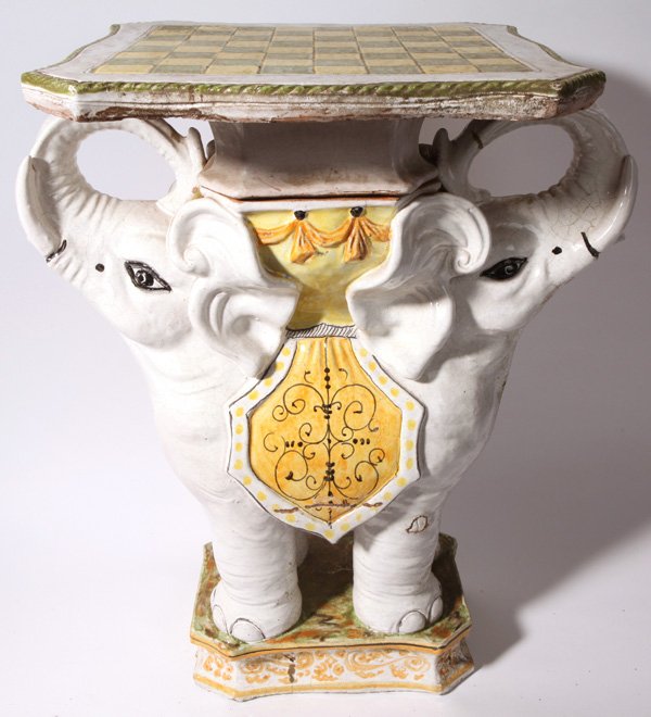 Terra Cotta Elephant Garden Table: Made in two pieces with checker/chess board top and double headed elephant base. Made in two pieces, the lid is removed to reveal two compartments for storing gaming pieces. All in nice polychrome ena