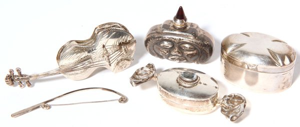 Four Silver Pill/Scent Boxes: Including three figural pieces; violin with bow, hard candy in wrapper with inset blue gem stone, perfume in form of jack-o-lantern with jet stone stopper and oval box. Largest is 2.75" long.