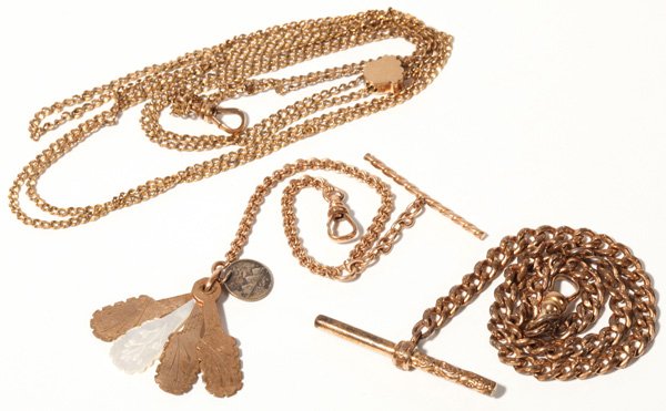 Gold Filled Watch Chains (3 Pieces): First: One gold filled ladies slide chain, one small watch chain with unusual fob. Second: Fan style with engraved pearl and gold filled slats, and 1/4 Real 1896, (holed) from Guatemala. Third: One ma