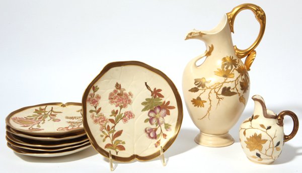 Lot of Royal Worchester: Lot of 8 pieces includng set of six lilly pad form porcelin desert plates, hand painted with different flowers and gilt highlights, 7.5" diameter; plus a large ewer with gilt flowers and handle, 11" h
