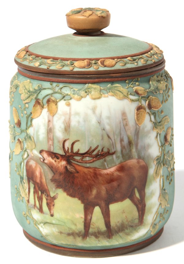 Hand Painted Nippon Tobacco Jar: With relief moriage vining oak leaf and acorn decoration and painted elk in forest setting, marked "Hand Painted Nippon" with "M" in laurel wreath, 4.5" diameter x 5.75" high.