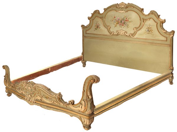 Louis XV Style Carved & Painted Bed: King size, with elaborately carved head and foot boards, side rails and all in origial floral painted design, circa 1900. 80" wide x 90" long x 56" high.