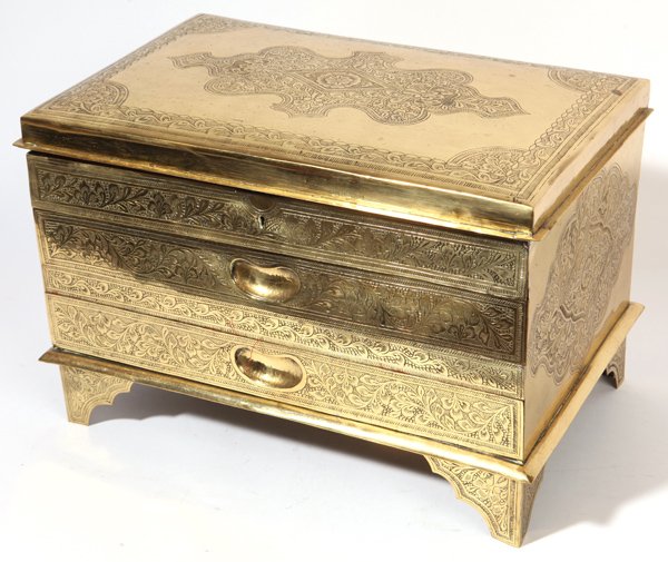 Persian Brass Jewelery Casket: With all over engraved stylized floral designs, on bracket feet with two drawers in front and lift lid with divided interior. 11.25" x 17" x 11" high. Circa 1900.