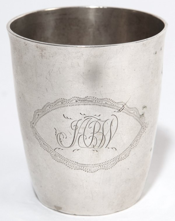 Coin Silver Jigger: American, circa 1800, barrel form with small silver mark on base, possible a eagle head, engraved monogram "HBW" with engraved oval surround. 2.15" diameter x 2.5" high.