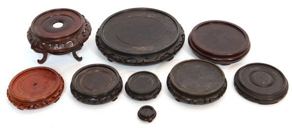 Lot of Nine Chinese Teak Stands: Various sizes.