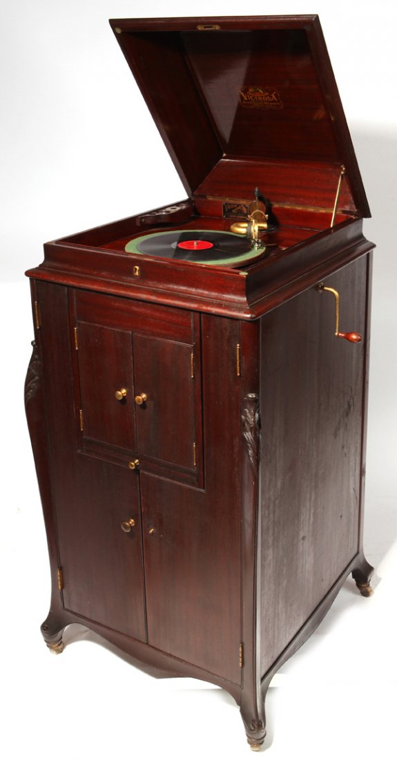 Victor Upright L-Door Phonograph: Victor VV-XV phonograph with original Victor Exhibition reproducer, mahogany case with L-doors and record tray. Original finish. 50" H x 22" W x 23" D.