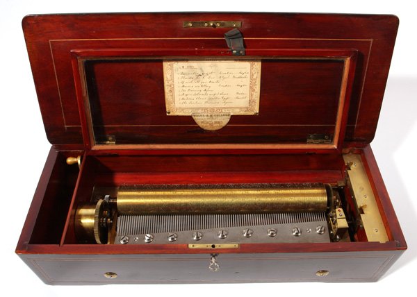 Nicole Freres 13 1/2" Cylinder Music Box: With marquetry inlaid rosewood case with Alpine shephard and dog, ebonized thumb molded edges, with printed and inked manuscript list of 8 songs, with key to lock. 8 1/2" x 22" x 5 3/4".