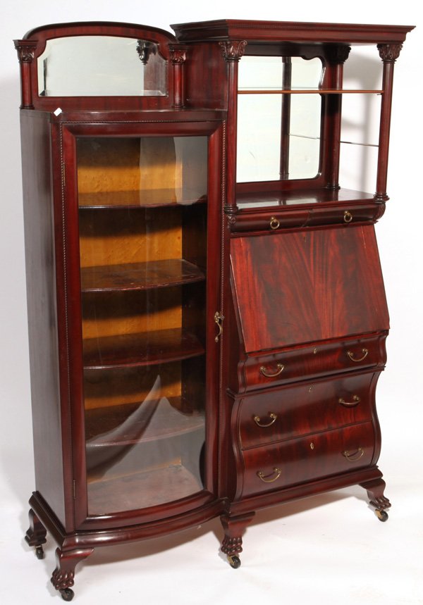 Fine Hooded Curved Glass Secretary Desk: Great mahogany secretary by Robert Mitchell Furniture Co. with double scalloped beveled mirrors, carved acanthus columns with two small drawers above drop front desk above three bombay drawers on one 