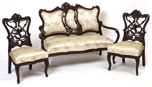 Laminated Victorian 3 Piece Parlor Set: Includes loveseat with laminated back, pierced carving and floral carving at top, and two side chairs, each with laminated backs and matching carvings. Loveseat 37" H x 49" W x 24" D. Chairs 35" H x 1