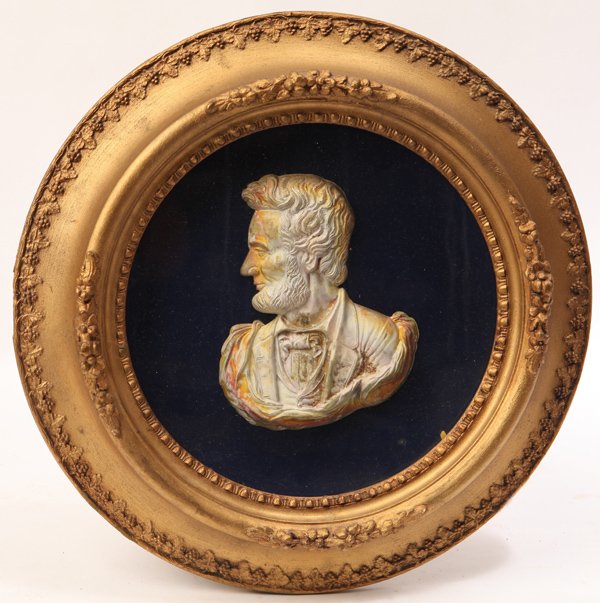 Memorial Relief Portrait of Lincoln: Circa 1865. A chest length profile plaster relief casting with original gilt andf painted finish marked along lower right, "J. Powell, Patented 1865" in original gold painted round frame. 16" diameter