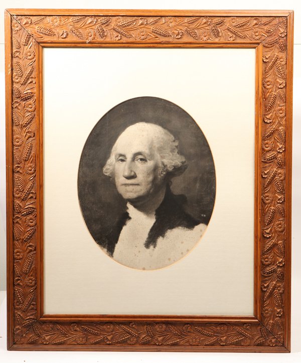 Washington After Gilbert Stuart: An oval lithograph shoulder length portrait of George Washington after the unfinished Stuart portrait. Sight 25" x 18", matted and housed in a finely carved oak frame 29 1/2" x 35".