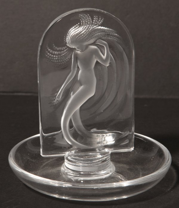 Lalique Figural Ring Tray: Circular base with arched table in center with nude woman with flowing hair, engraved signature on base Lalique France, 3 3/4 diameter x 4 inches high.