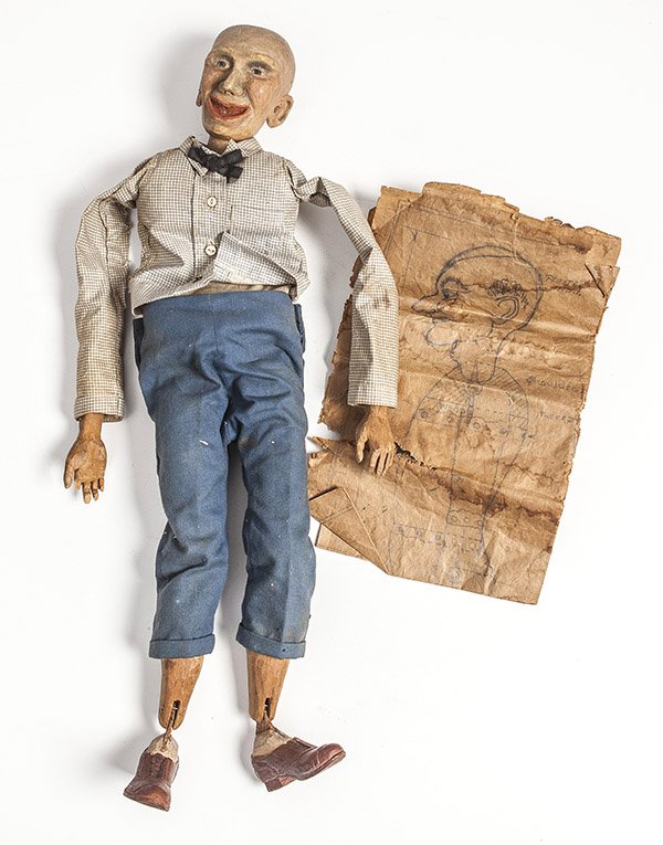 Carved Folk Art Doll with Original Drawing: A circa 1900 carved and painted folk art doll in original clothing of a comic looking toothless bald old man, jointed construction, 20" high. Includes the original pencil sketch plans, life size used 