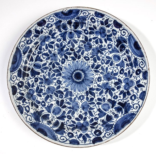 Early Persian Porcelain Charger: Circa 18th century or earlier, with all over blue painted loral designs, onion skin finish on base and blue character mark on base, 14" diameter.