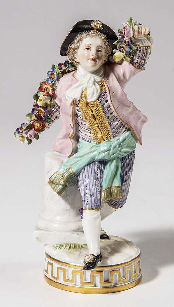 Meissen Figure: Gentleman with wreath of flowers, blue underglaze crossed sword mark and inscised "F.67." on base, 6 3/4" high.