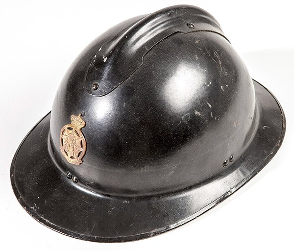 WWII French Police Helmet: In original black painted finish with brass shield on front and original liner, 9 x 12 x 6" high.