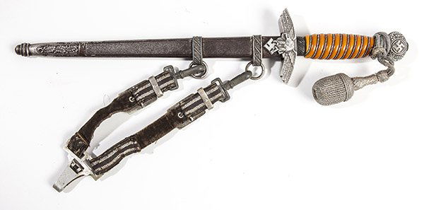 THIRD REICH Dagger: With 10 1/4 inch double edged steel blade marked on left side Meyersberg & Co. Solingen, surrounding a sword with laurel wreath with round cast white metal pommel with laurel leaves and swastika, guar