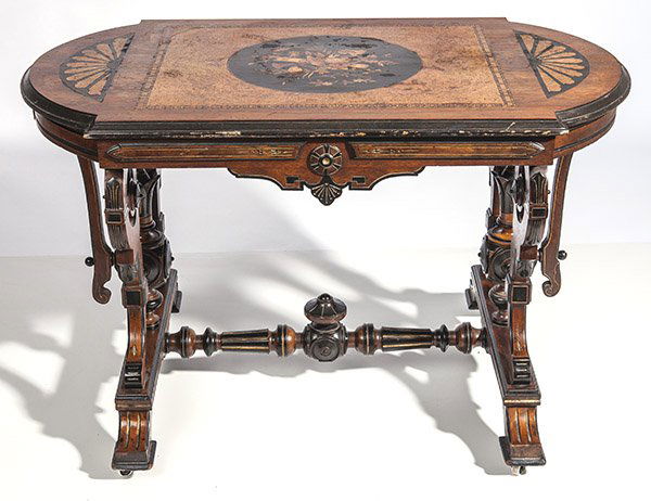 American Renaissance Victorian Inlaid Parlor Table: Circa 1875 with many exotic hardwood inlays. Top with central inlaid panel of musical instruments and flowers, surrounded by oysterwood and triple cross banded inlay, "D" form ends with inlaid fans, s