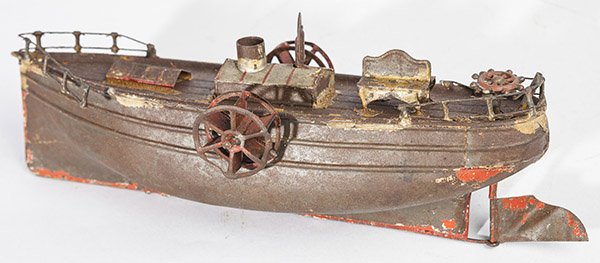 GERMAN SIDEWHEEL STEAMBOAT TOY: in tin and cast pewter in original red & brown painted finish with working paddle wheels and stering wheel for rudder, 10 1/2 x 4 x 4" high.