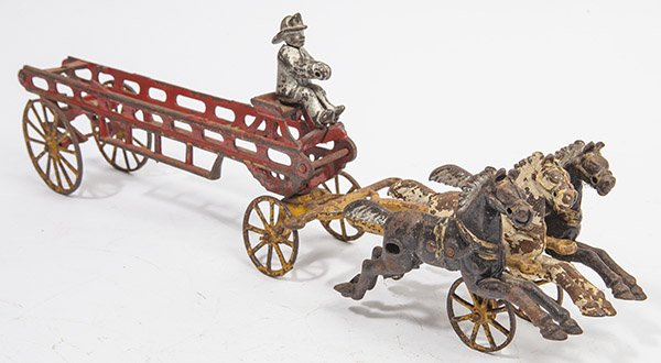 CAST IRON FIRE LADDER WAGON: with triple horse team in original polychrome painted finish, 3 1/2 x 18 1/2 x 6" high.