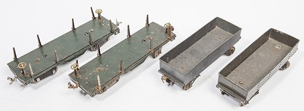FOUR LIONEL STANDARD GAUGE RAIL CARS: including two log cars, both in original painted & plated finish, 3 1/2 x 11 1/4 x 3 1/2" high; and two "Rock Island Lines 65784" open cars in original painted finish, 3 1/2 x 9 1/2 x 2 3/4" high.