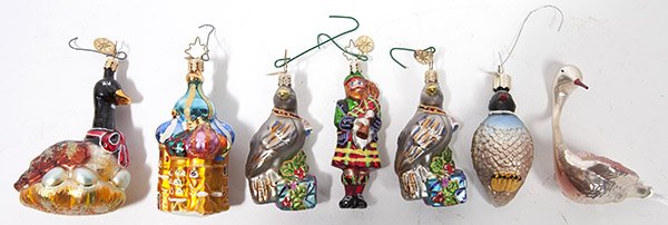 7 MODERN RADKO FIGURAL CHRISTMAS ORNAMENTS: all with embossed tin oval tags with 8-pointed star, includinggoose on nest of eggs, 4" long; plus Greek Orthodox Church, 3 3/4" long; plus Highland Bagpiper, 3 3/4" long; plus 2 birds atop Christmas 