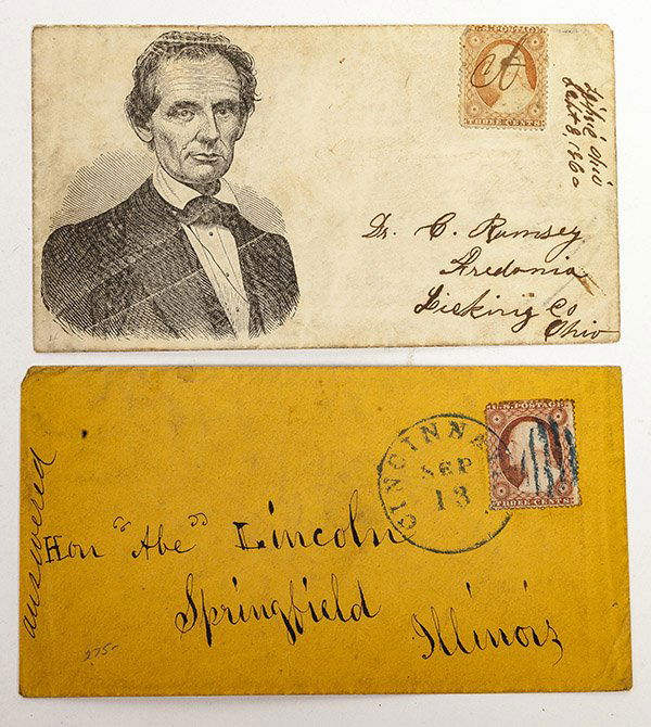 Two Lincoln Postal Covers: One with illustration of a beardless Abe with red Washington three cent stamp and second addressed in black ink Hon. Abe Lincoln Springfield Illinois with circular Cincinnati Sep 13 cancellation and r