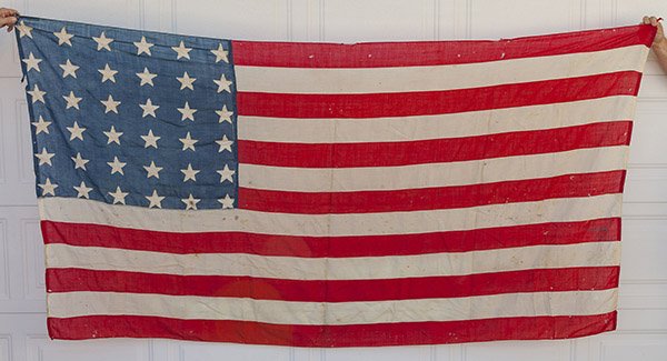 Civil War 36 Star U.S. Flag: In linen with hand sewn canton to fly, six rows of six five-pointed stars sewn to each face, machine sewn canton and hoist with white linen tag sewn in upper corner of canton with period inked inscrip