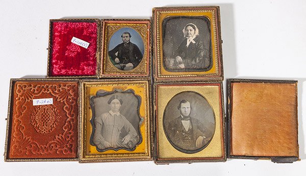 Four Early Cased Photographs: Including three sixth plate dagyerreotypes, portrait of a young lady, older lady and young gentleman, and ninth plate hand colored ambrotype portrait of a young gentleman, beautifully hand colored.