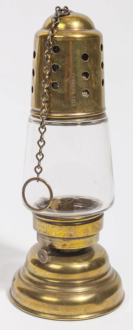 Early Brass Skaters Lantern: a fine early brass and glass sketers lanter, marked on top "Pat'd Dec. 24, 1887" with blown clear glass and original brass chain for hanging, 4" diameter at base x 10" high, less chain.