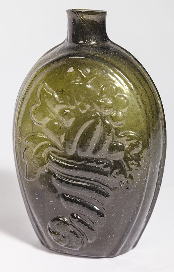 Olive Green Cornicopia Flask: with reverse side having urn of fruit in nice dark olive green color, snapped pontil, and fire polished lip, 6 3/4" high.