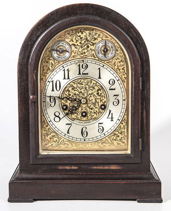 Seth Thomas Bracket Clock: Brass dial with engraved floral scroll work, silvered chapter ring with Arabic numerals and smaller silvered dials above for speed and chimes, brass ight day time, strike & chimes spring driven moveme