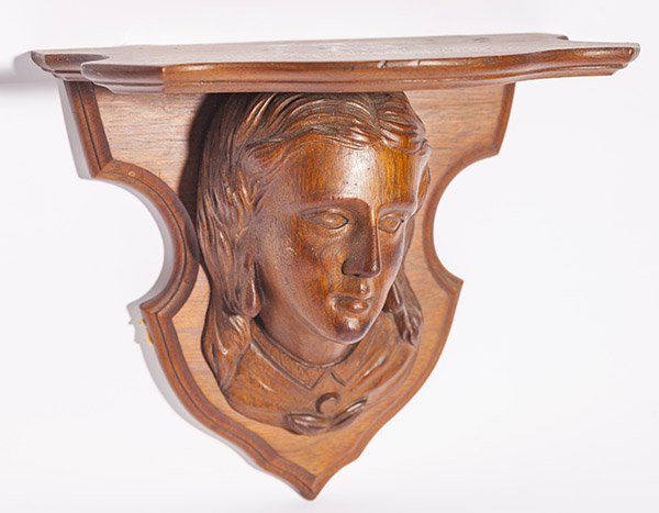 Fine Figural Clock Shelf: Victorian in Walnut with bust portrait of a young lady, 7 1/2 x 11 3/4 x 10 1/4" high.