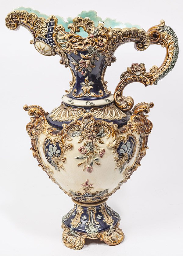 Massive Majolica Ewer: circa 1890 with hand painted polychrome on high relief scrolled floral decoration, two piece attched with original cut steel nut & bolt, marked on base with relief chewing gum style mark of "WS & S", 
