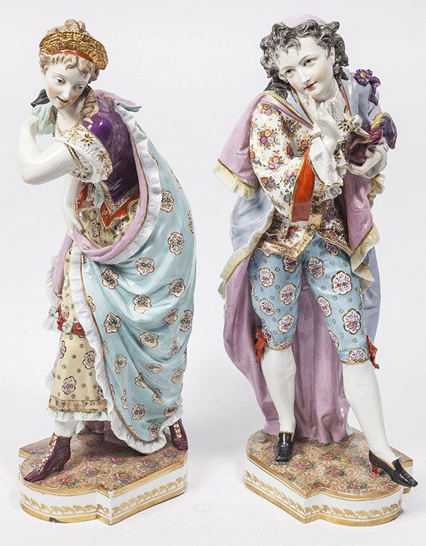 Pair Fine Meissen Style Porcelain Figures: 19th century, marked on underside with blue underglaze crossed "T" with single dot at top in imitation of Meissen's crossed sword mark. Beautifully painted young lady and gentleman dressed in 18th cen