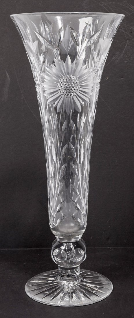 American Cut Glass Trumpet Vase: with cut daisies with leaves and nails head centers, star burst base, 6 1/4" diameter x 15 3/4" high.